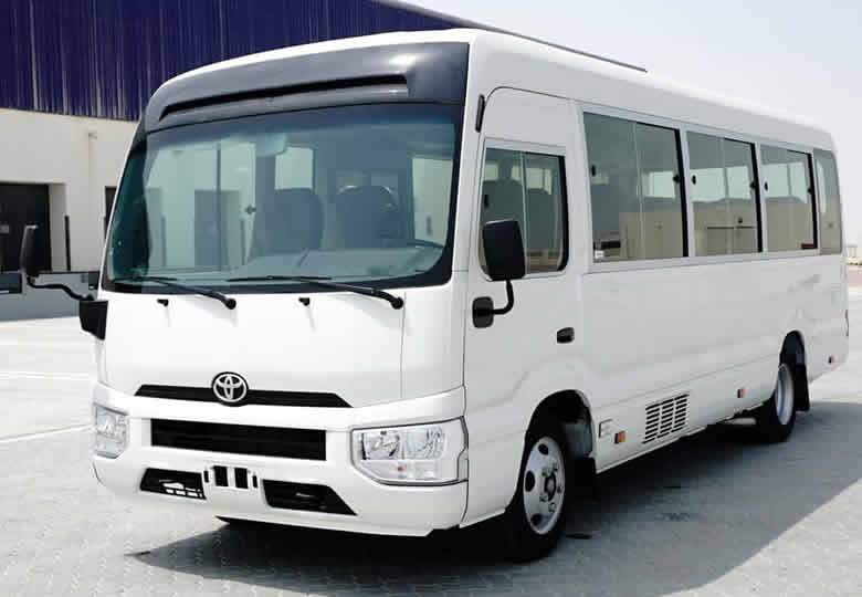 Book Coaster bus rental Rwanda for group tours, staff transport, airport transfers, conferences, and private road trips with flexible pickup in Kigali.