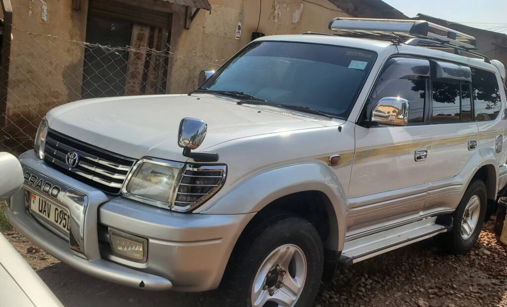 Book Toyota Land Cruiser Prado rental Kigali for self-drive trips, airport pickup, family travel, and reliable 4x4 road trips across Rwanda and Uganda.